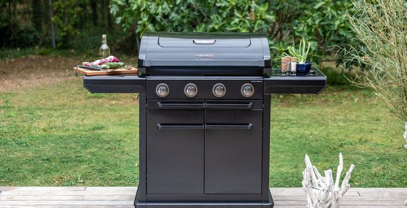 Campingaz 4 Series Onyx S Outdoor Gas BBQ Grill in a garden setting