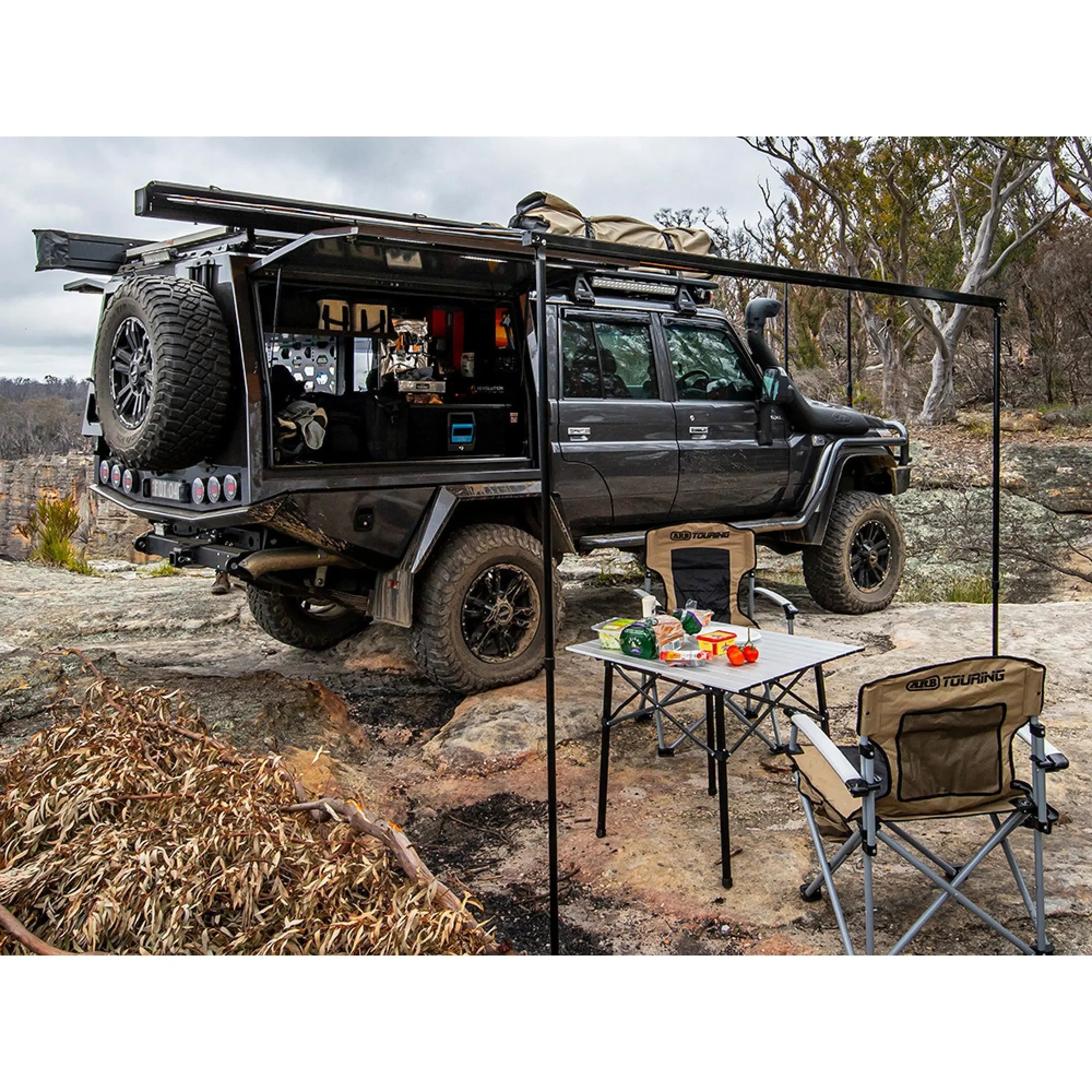 Aluminium Awning with LED Light Kit - 2m x 2.5m installed on a 4x4 vehicle in a rugged outdoor setting