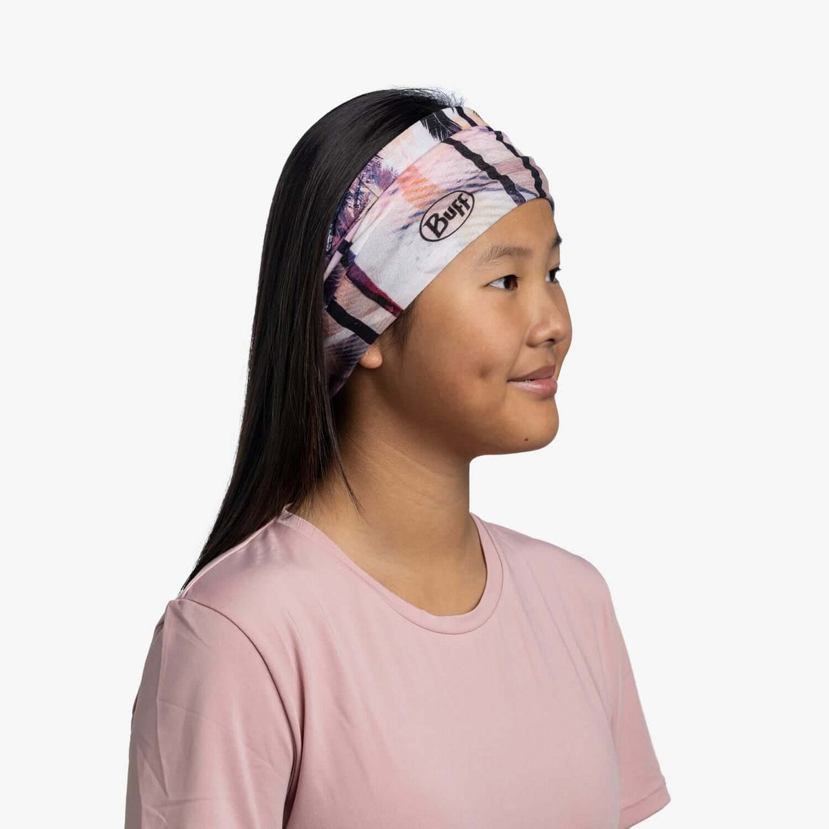 Child wearing Buff CoolNet UV Neckwear Youth - Coasty Multi for sun protection.