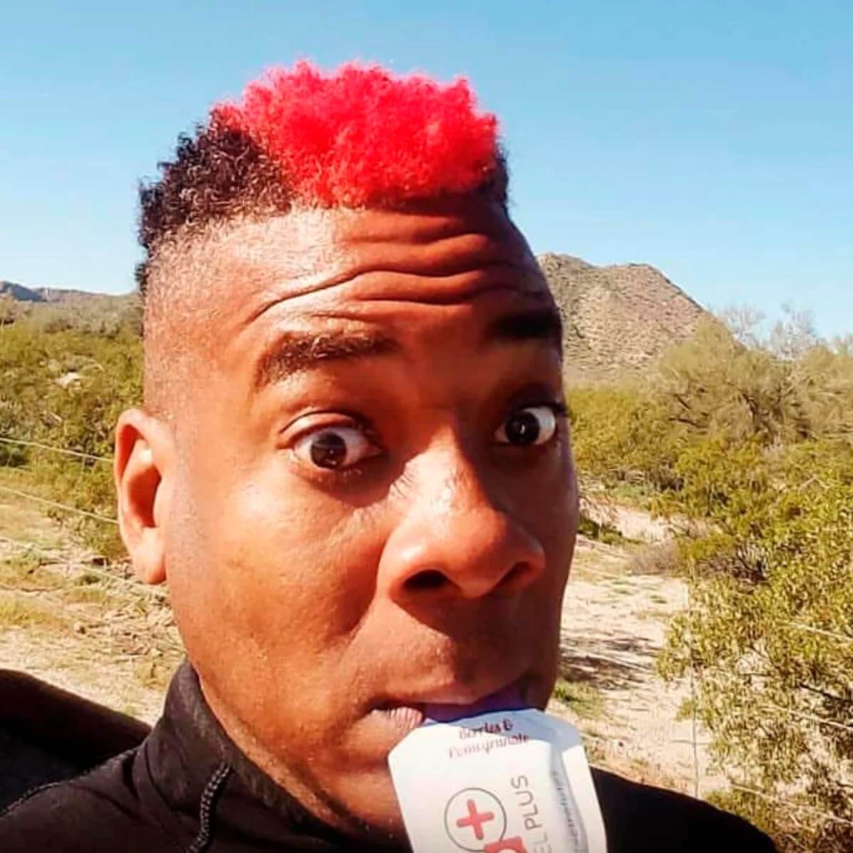 Person enjoying Huma Chia Energy Gel Plus - Berries & Pomegranate outdoors