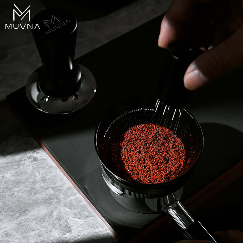Muvna Espresso Magnetic Dosing Funnel in use, dispensing coffee grounds during espresso preparation.