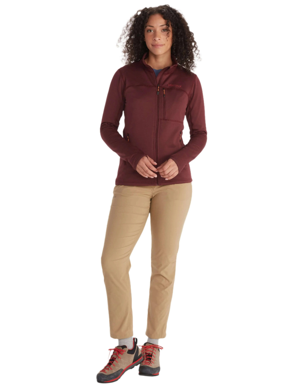 Woman hiking in UAE mountains wearing Marmot Preon Jacket