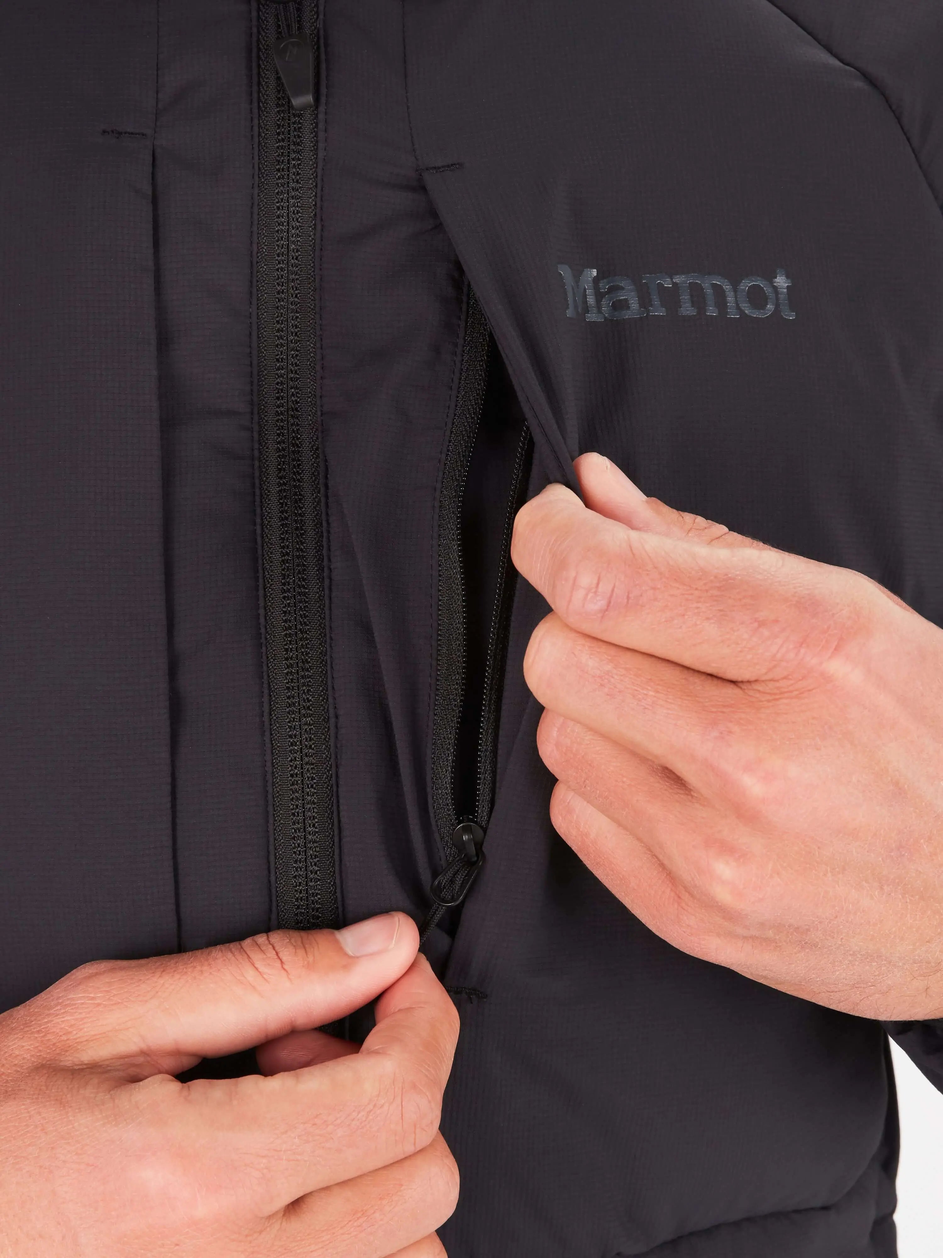 Close-up of Marmot Warmcube men's winter jacket with zippered pocket detail.