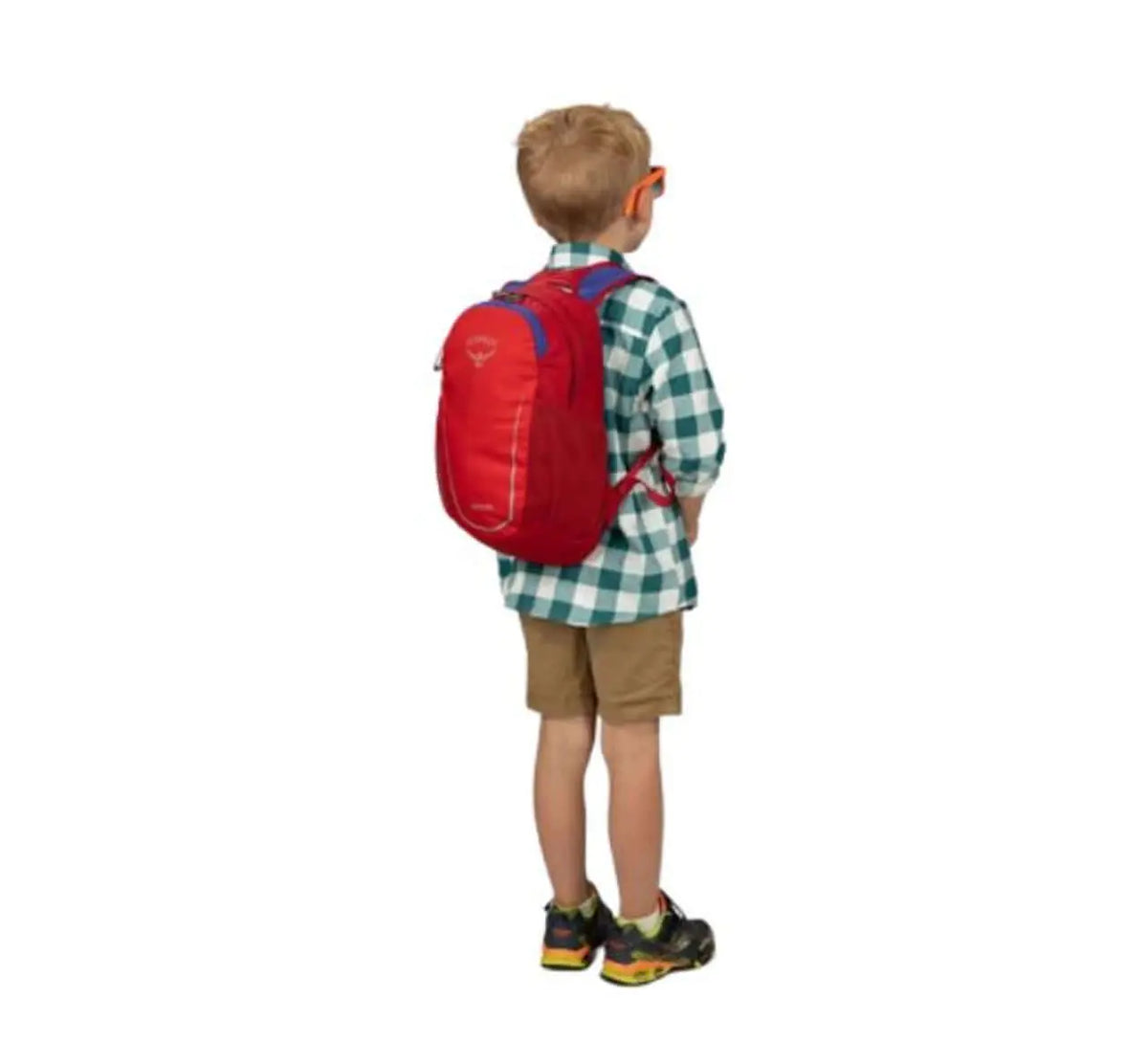 Child wearing Osprey's Daylite Jr. - Kids backpack in red, featuring ventilated backpanel and side mesh pockets, outdoor ready.