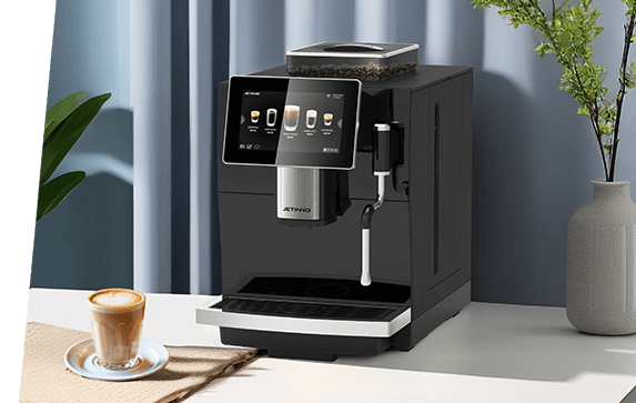 Jetinno JL09 automatic espresso coffee machine on a kitchen counter with a cappuccino ready beside it.