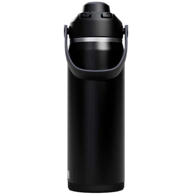 Hiker drinking from the Camelbak Thrive Chug Insulated Bottle on a rocky trail