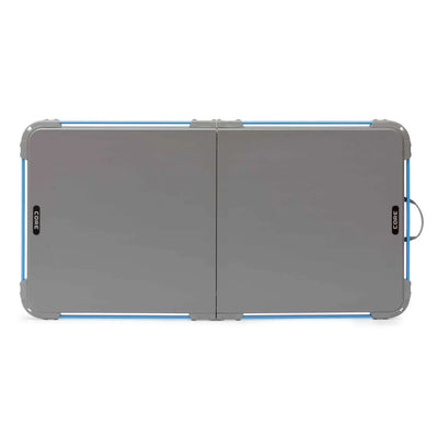Core Equipment 4 Foot Outdoor Table with FlexRail — folded size comparison around 25 x 26 inches for transport.