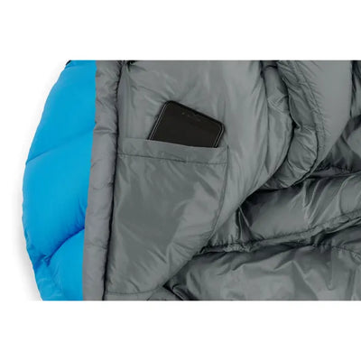 Close-up of Core Equipment 30 Degree Mummy Sleeping Bag with pocket holding a smartphone, showcasing high performance material.