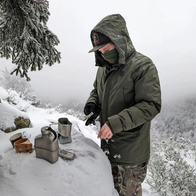 Person using SilverAnt Titanium Canteen Military Mess Kit in snowy outdoor setting