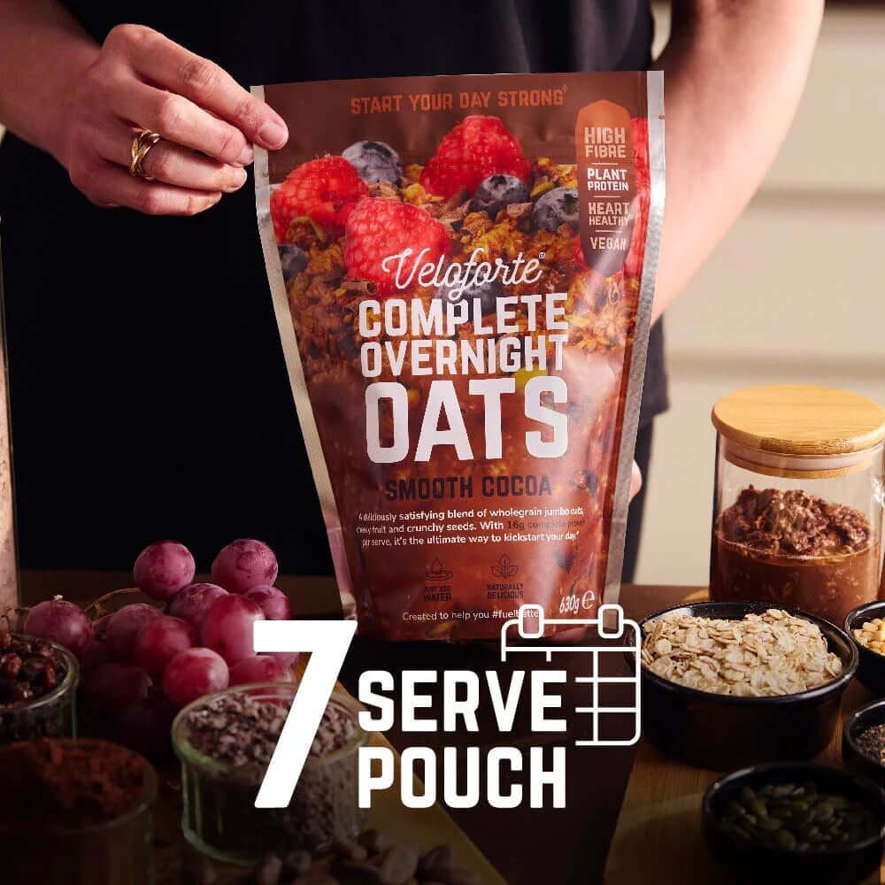 Veloforte Smooth Cocoa Complete Overnight Oats - 630g 7 serve pouch with nutritious ingredients on a breakfast table.