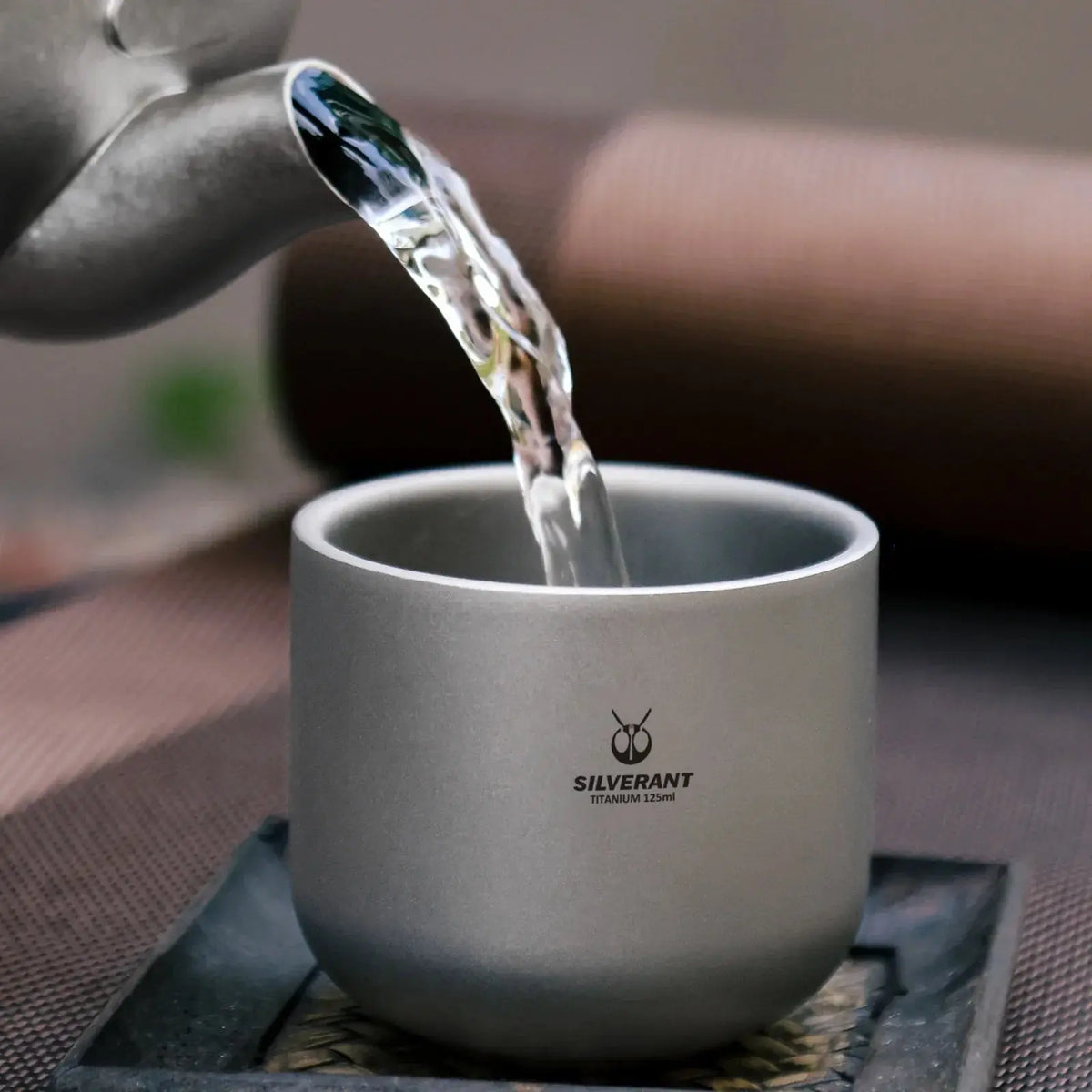 Top view of the SilverAnt Titanium Tea Cup Double Wall - 4 oz filled with hot tea