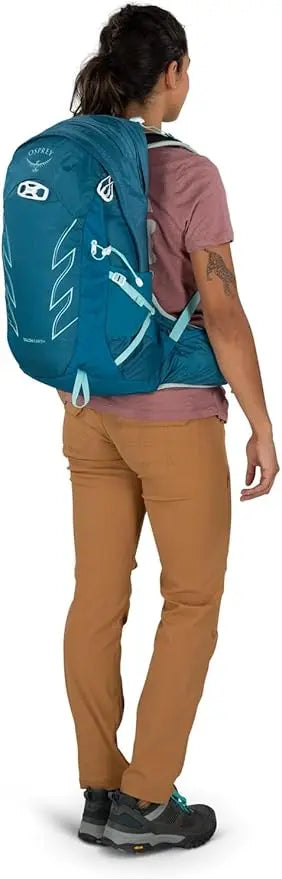 Man wearing Osprey Talon Earth 22 hiking daypack on trail