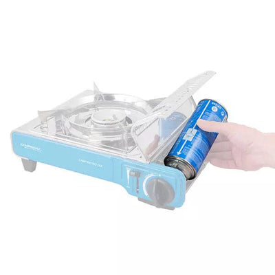 Inserting a Campingaz CP250 Isobutane Cartridge into a portable stove for efficient outdoor cooking.
