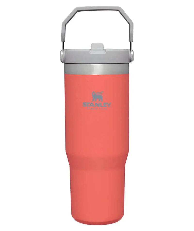 Stanley Classic IceFlow Flip Straw Tumbler - 30 oz / 890 ml in coral color with a handle.