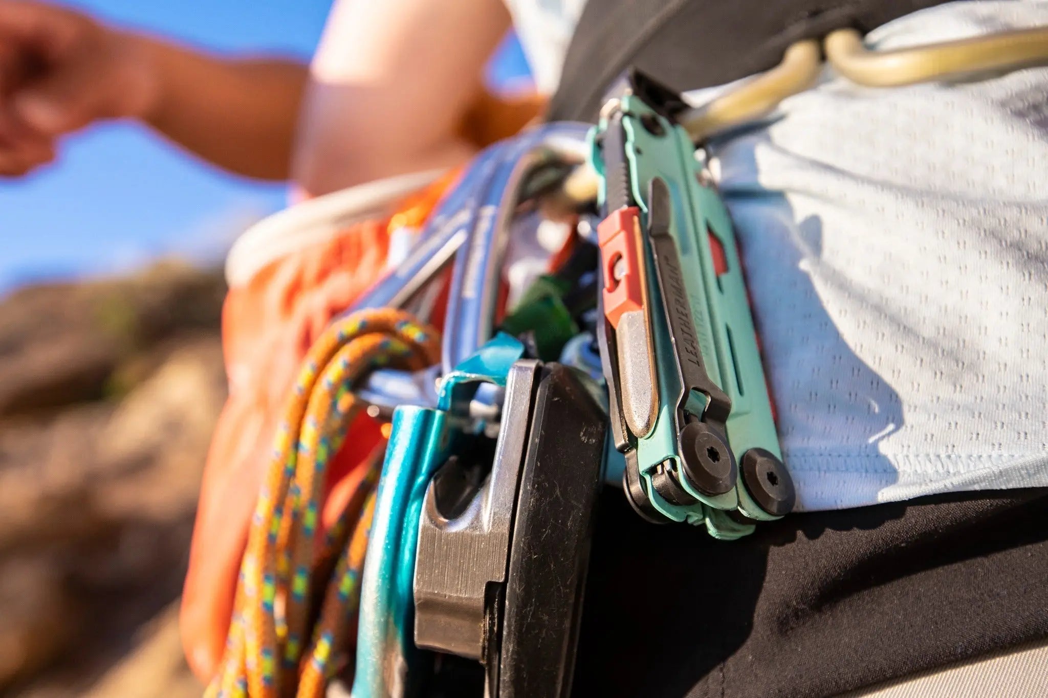 Leatherman Signal multi-tool clipped to a belt of an adventurer ready for outdoor exploration.