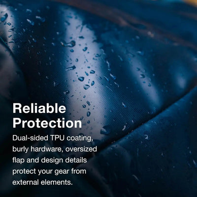 Close-up of weather-resistant fabric on Osprey Transporter Duffel 120 highlighting dual-sided TPU coating and rugged design.