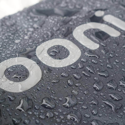Close-up of Ooni Carry Cover for Ooni Koda 12 with water droplets showcasing durability in wet conditions