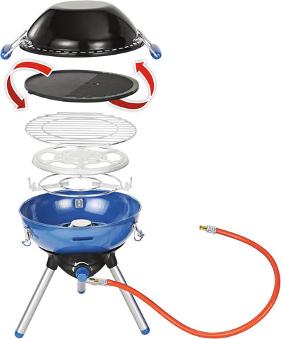 Campingaz Party Grill 400 showing multiple cooking surfaces and wok lid