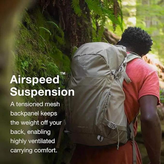 Man hiking with Osprey Hikelite 32 - Black backpack featuring AirSpeed™ suspension, perfect for comfortable and ventilated all-day adventures.