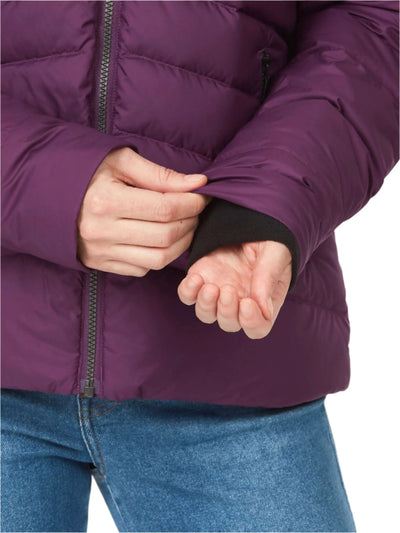 Close-up of a woman wearing the Marmot Ithaca Jacket adjusting the sleeve, showcasing its warm down insulation.