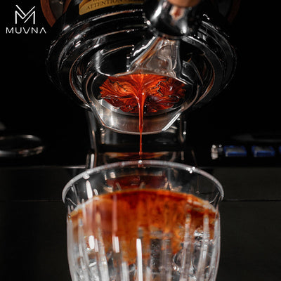 Espresso flowing through Muvna Lucifer Bottomless Portafilter, highlighting the 58mm black resin design, perfect for coffee enthusiasts.