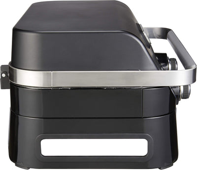 Side view of the Campingaz Attitude 2100 LX portable gas grill, showcasing its compact design ideal for outdoor cooking.