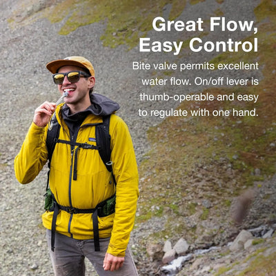 Hiker using Osprey Hydraulics LT 1.5 L Reservoir with bite valve for easy flow control in outdoor setting