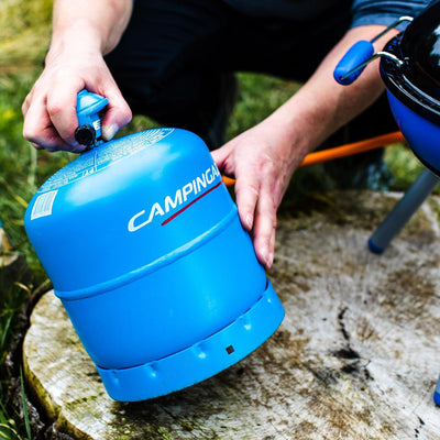 Camp stove setup with Campingaz Party Grill 400 outdoors, highlighting versatility for cooking in UAE's natural landscapes.