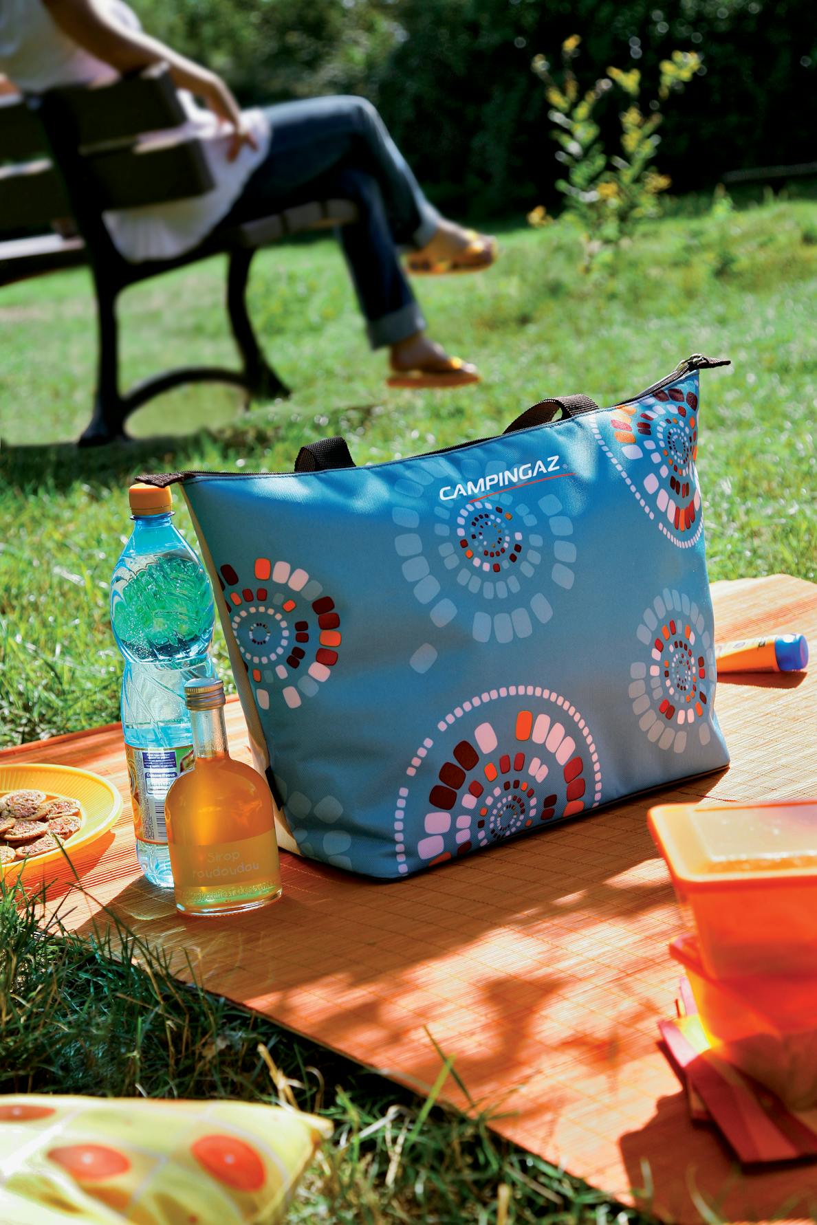 Campingaz Ethnic Shopping 15L Soft Cooler Bag on outdoor picnic blanket.
