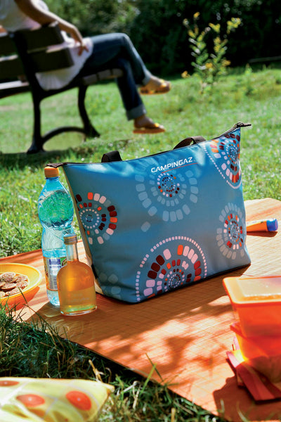 Campingaz Ethnic Shopping 15L Soft Cooler Bag on outdoor picnic blanket.