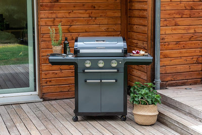 Campingaz 3 Series Premium S Gas Grill on a wooden patio, showcasing sleek design and functionality for outdoor cooking.
