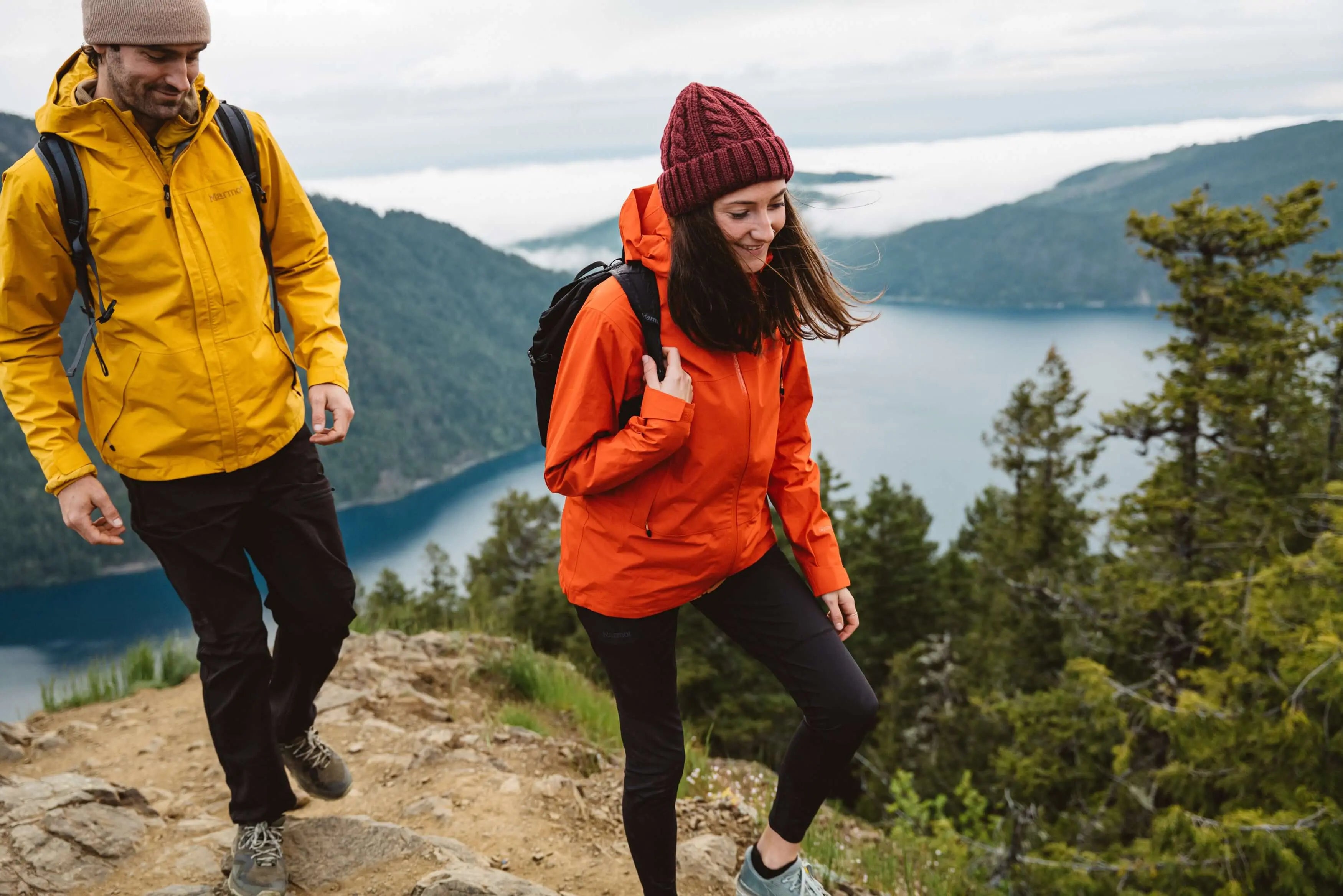 Hikers wearing Marmot Gore-Tex Minimalist Pro Jacket - Women on a scenic mountain trail.