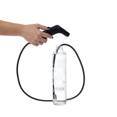 Person using the Hygiene Collective Bliss Rechargeable Travel Bidet