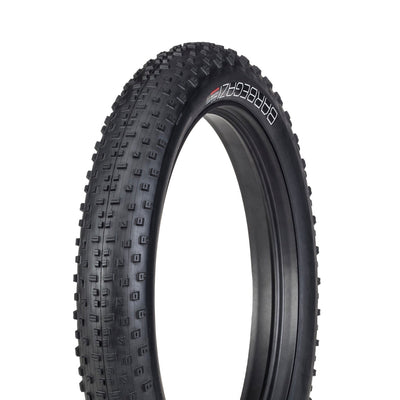 Black tire with tread pattern on a white background