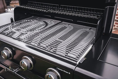 Close-up of Campingaz 4 Series Onyx S Outdoor Gas BBQ Grill with open lid highlighting the cooking grates.