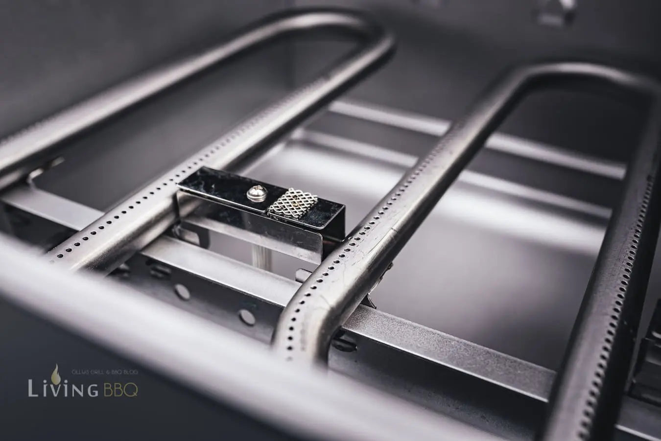 Close-up of the Campingaz 4 Series Onyx S gas grill burners showcasing precision design for outdoor cooking.