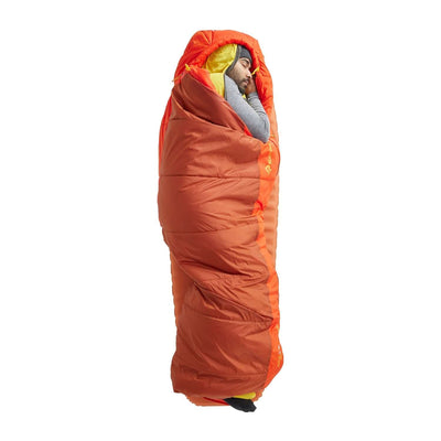 Person sleeping in the Sea to Summit Hamelin Synthetic Sleeping Bag 15F, showcasing its warm and cozy design.