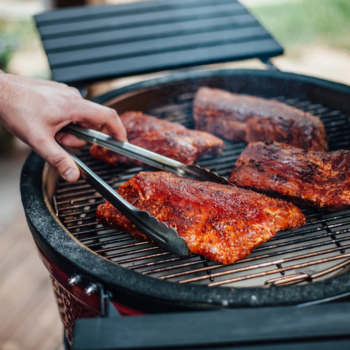 Kamado Joe Classic Joe Grill - Series I being used outdoors