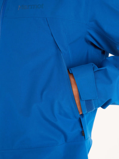Close-up of Marmot Gore-Tex Minimalist Pro Jacket - Men's Shell in blue, showcasing zip pocket detail and waterproof material.