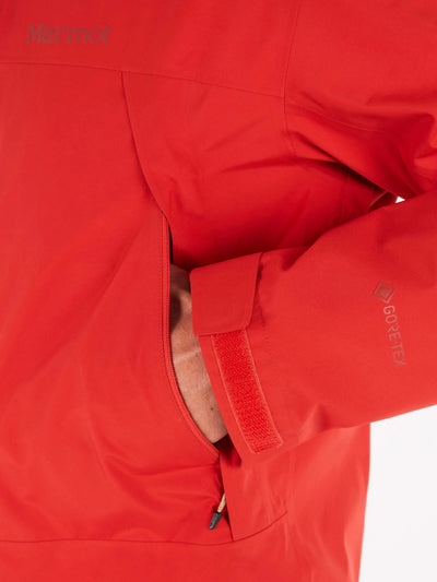 Close-up of Marmot Gore-Tex Minimalist Pro Jacket showcasing waterproof fabric and adjustable cuff on a red men's shell jacket.