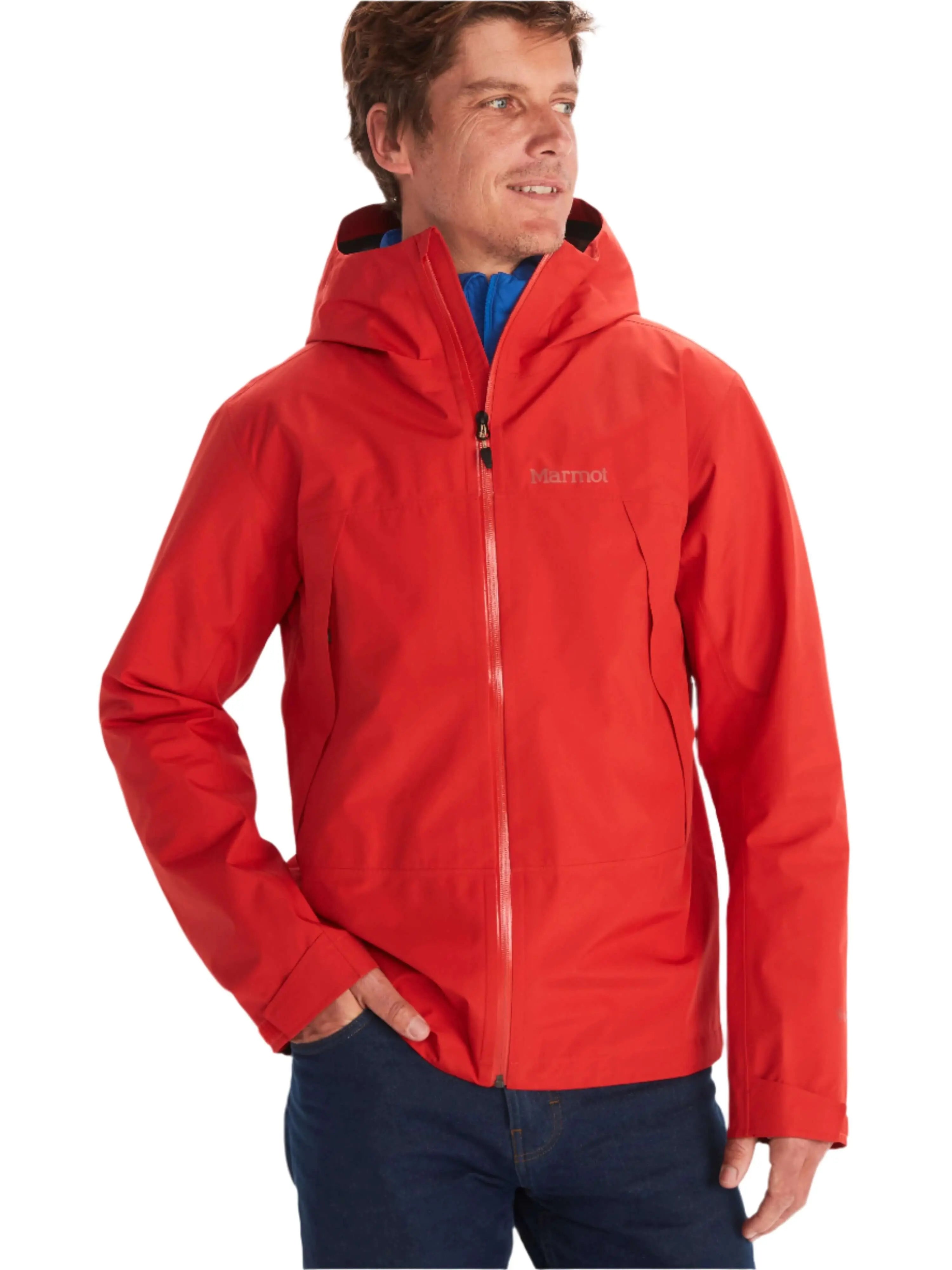Man wearing Marmot Gore-Tex Minimalist Pro Jacket in red, showcasing a waterproof shell ideal for unexpected weather conditions.