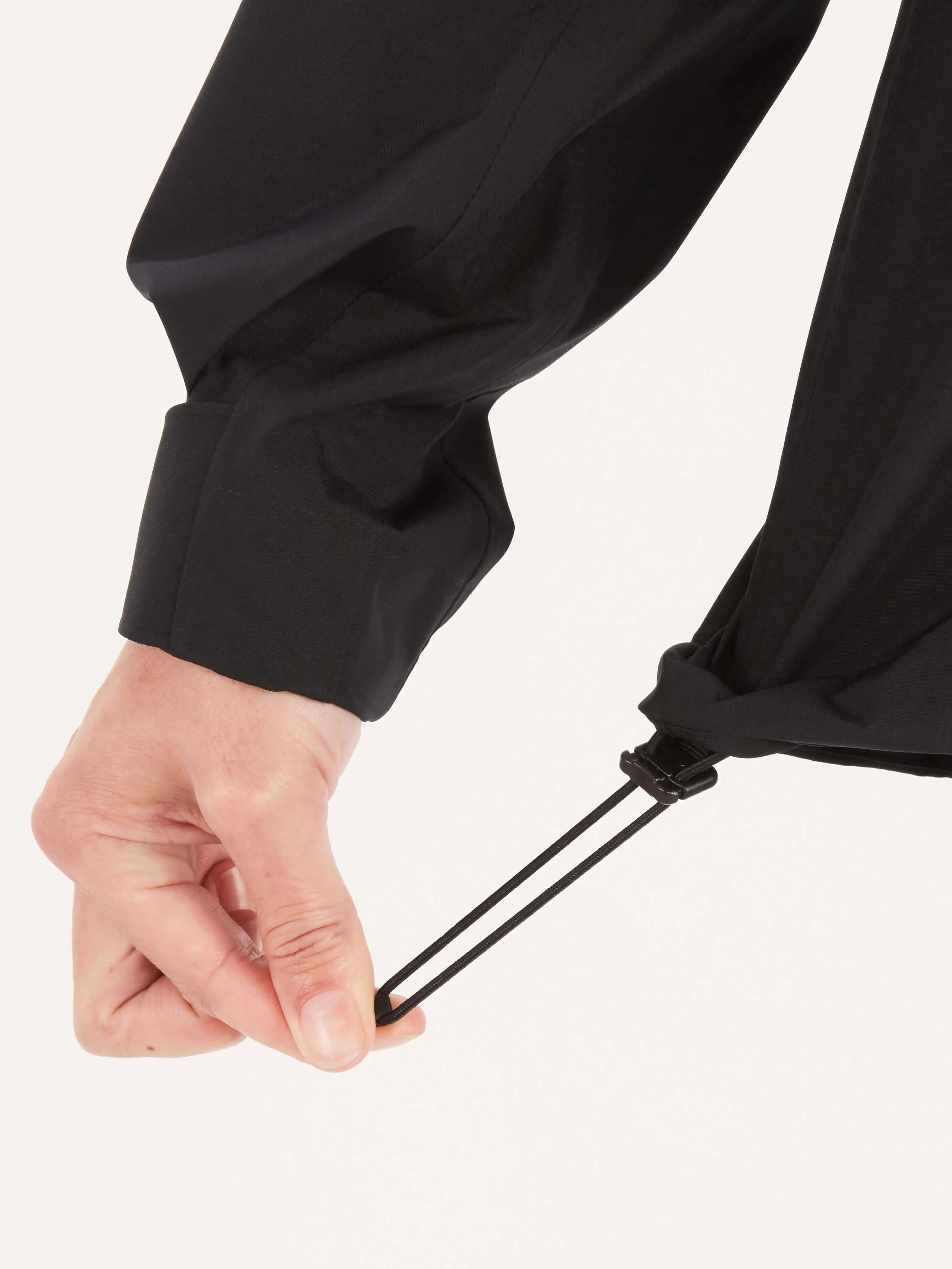 Adjusting the Marmot Gore-Tex Minimalist Pro Jacket's sleeve for a secure fit