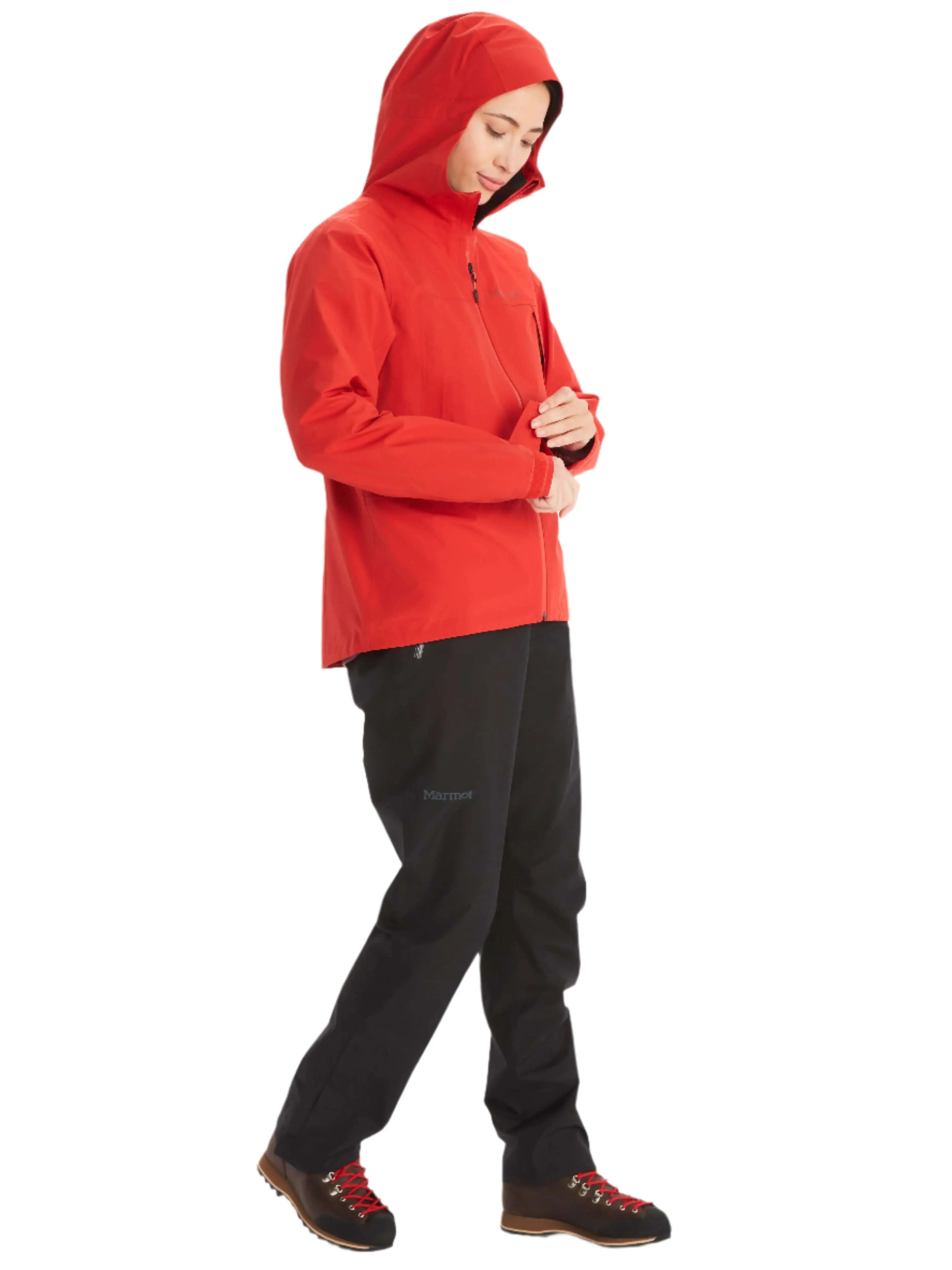 Woman wearing Marmot Gore-Tex Minimalist Pro Jacket in red, ideal for weather-defying adventure.