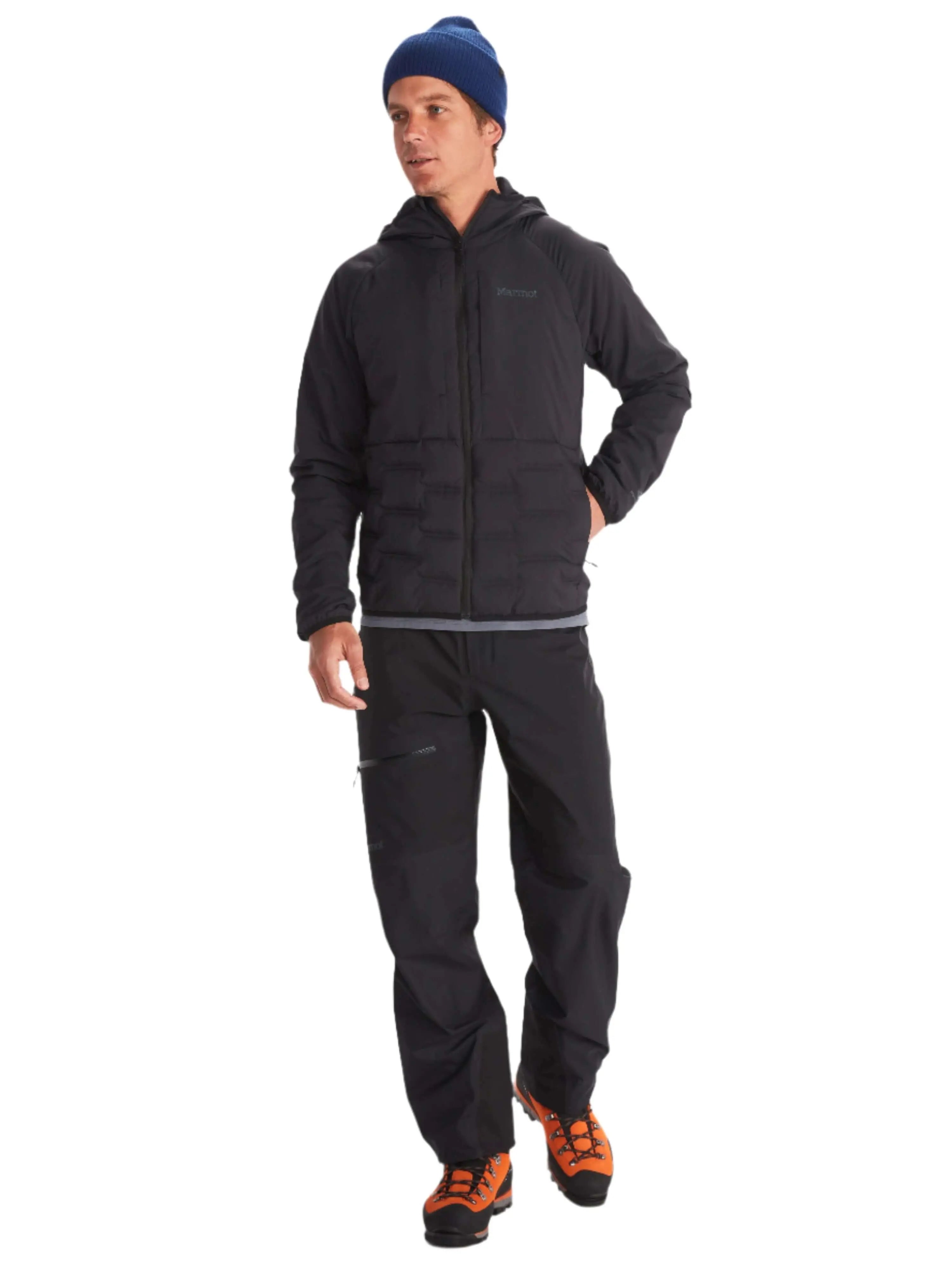 Man wearing Marmot Warmcube men's winter jacket and outdoor gear on a white background
