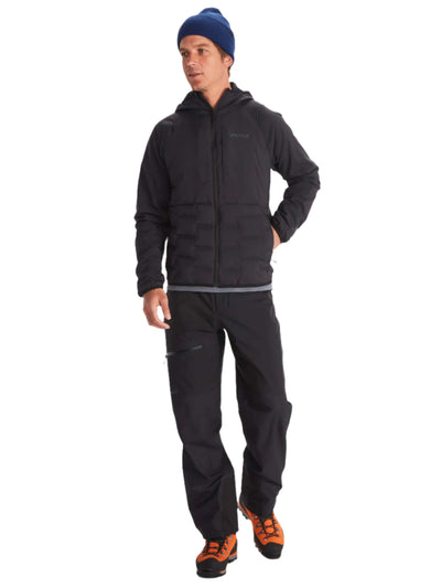 Man wearing Marmot Warmcube men's winter jacket and outdoor gear on a white background