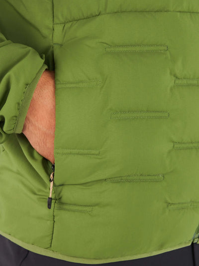Close-up of Marmot Warmcube men's winter jacket showing green fabric and zippered pocket detail.