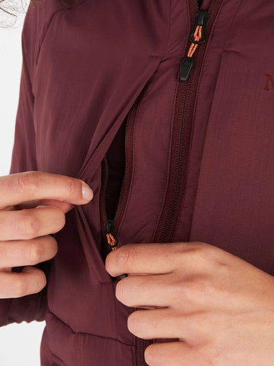 Woman wearing Marmot Warmcube jacket at a UAE desert campsite