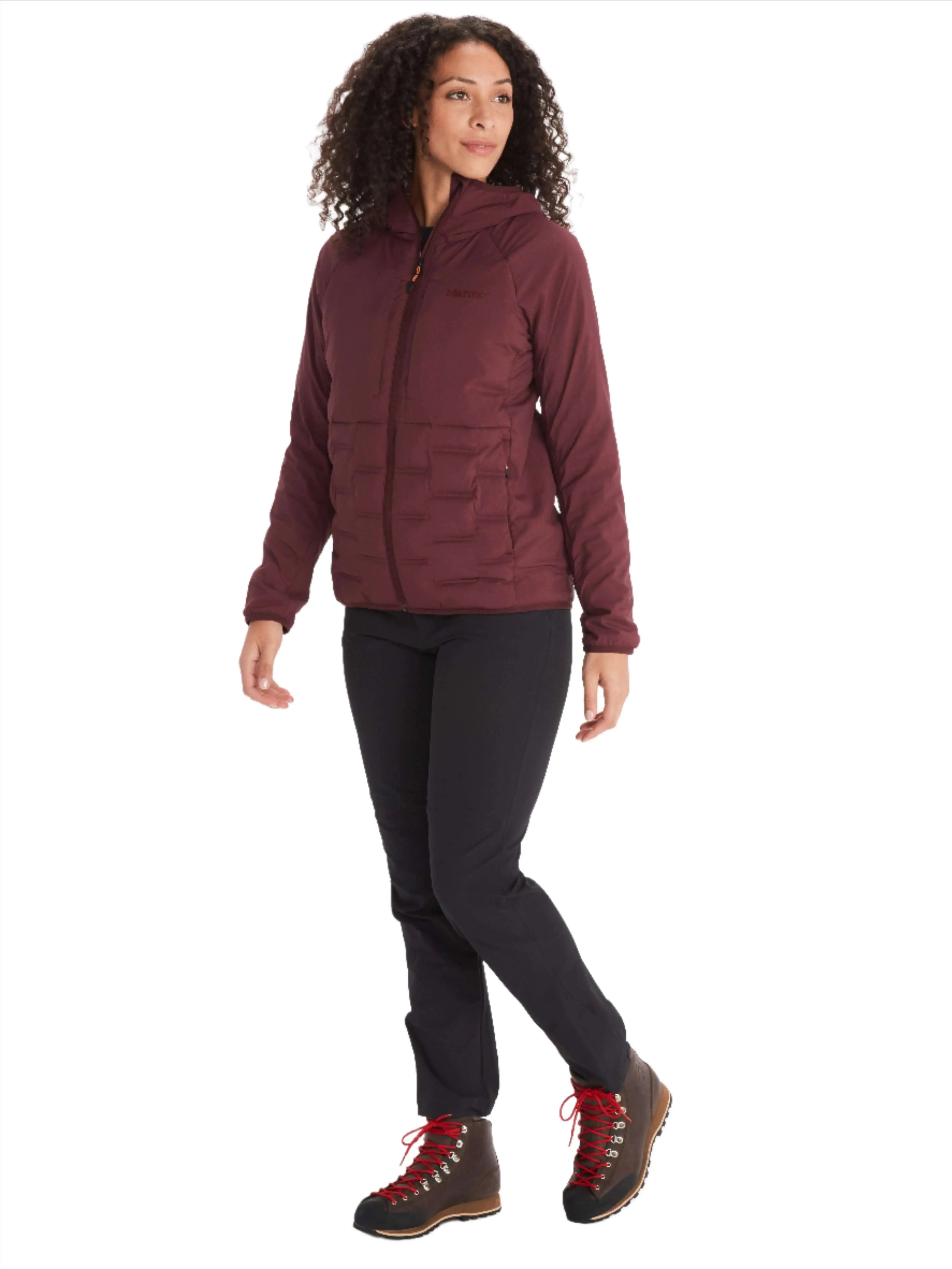 Woman wearing Marmot Warmcube Women's Active HB Jacket in winter gear pose