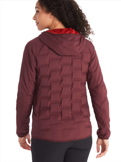Woman wearing Marmot Warmcube Women's Active HB Jacket in maroon, showcasing the 3D WarmCube construction for optimal warmth.