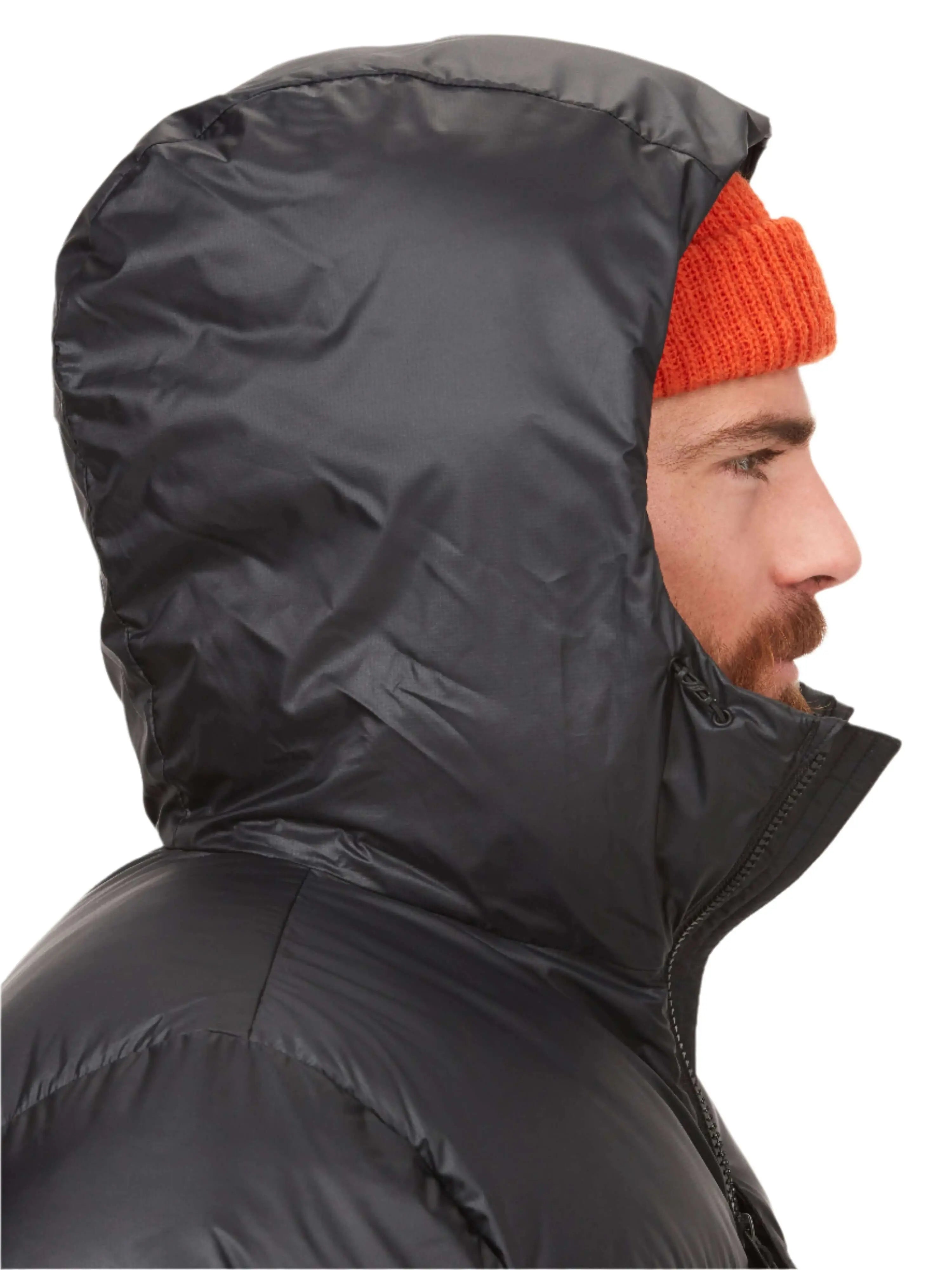 Hiker wearing the Marmot Guides Down Hoody on a UAE mountain trail